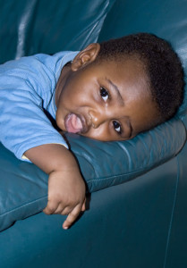 baby on soft sofa arm