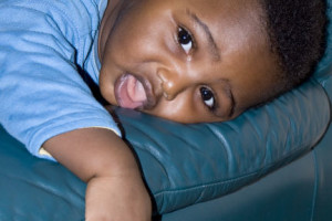 baby on soft sofa arm